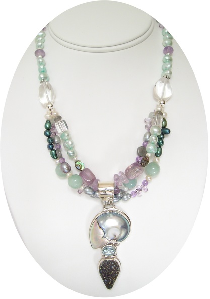 Shell_and_druzy_quartz_pendant_on_triple_strand_of_freshwater_pearls_amethyst_and_rose_quartz_necklace.jpg