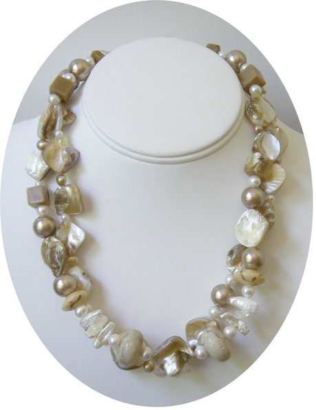 Double_strand_of_mother_of_pearl_freshwater_pearl_and_beige_coral_necklace.jpg