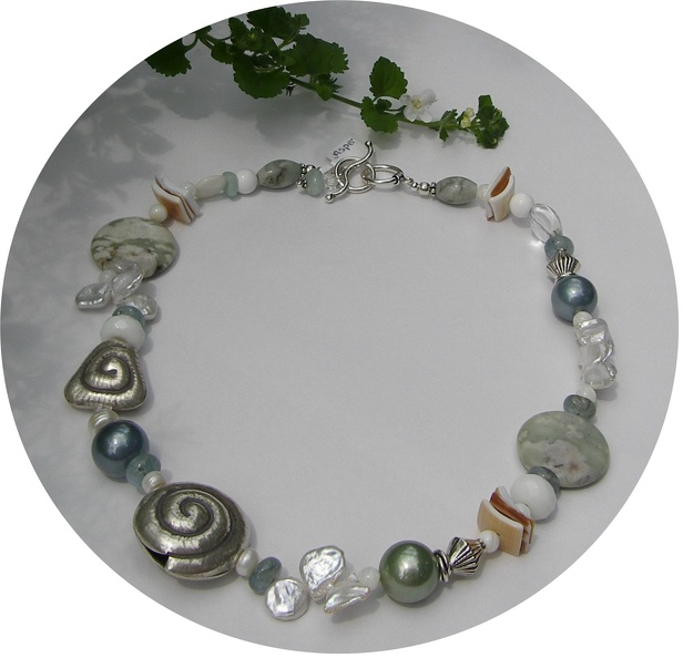 Jasper, rock quartz, pearl, shell and aquamarine with sterling accents create an usual and eye catching necklace.  R08  