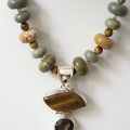 Close up of tiger's eye and smokey quartz pendant necklace.  19.75&quot; long 
TR2055   $155.00 