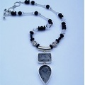 Double rutilitic quartz pendant on rock quartz and onyx.19"-20.5" long  RN1059  $239.00