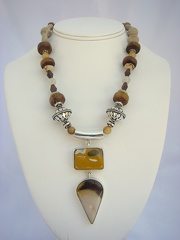 Double sterling pendant with mookite and jasper on a necklace of Bali sterling, wood, coral and angel hair quartz balls. 