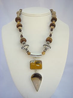 Double sterling pendant with mookite and jasper on a necklace of Bali sterling, wood, coral and angel hair quartz balls. 