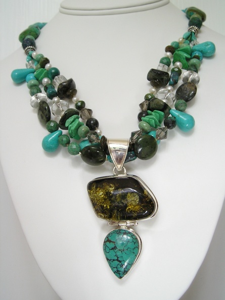 Green_amber_and_turquoise_sterling_pendant_on_triple_twist_necklace.jpg
