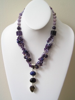 Triple sterling pendant of smokey quartz, amethyst and lapis on triple strand of pearls and amethyst necklace. 