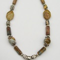 Green and brown triangular jasper and sterling pendant on ocean and picture jasper necklace.  up tp 21" long on expandaable